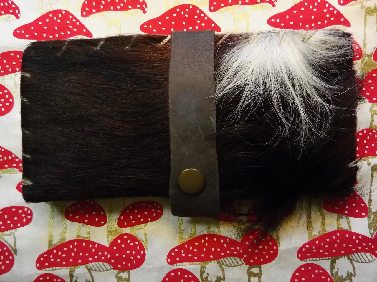 pouch with black and white fur